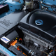 The electric motor in the engine bay of the Nissan Newbird EV